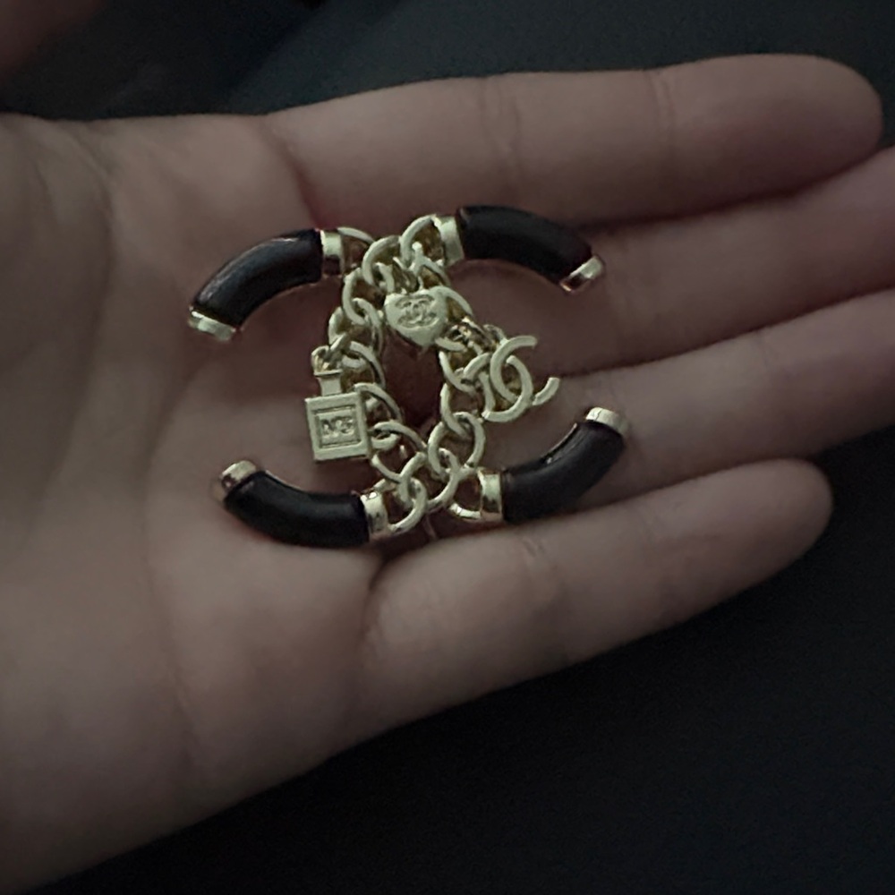 Gold-Tone CC Brooch with Black Enamel Accents